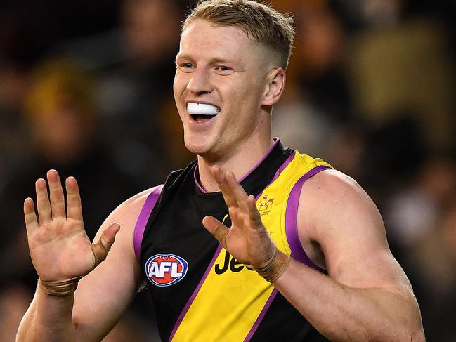 Josh Caddy of the Tigers reacts after kicking a goal during the Round 20 AFL match between the Richmond Tigers and the Hawthorn Hawks at the MCG in Melbourne, Sunday, August 6 , 2017. (AAP Image/Julian Smith) NO ARCHIVING, EDITORIAL USE ONLY