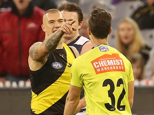 AFL Round 13. 17/06/2018.  Geelong v Richmond at the MCG .   Richmond's Dustin Martin tells field umpire Jacob Mollison to look at the big screen after Mollison awarded Geelong's Patrick Dangerfield a free kick for in the back   . Pic: Michael Klein