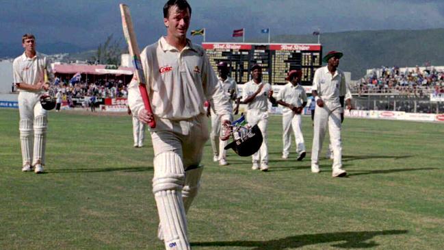 Steve Waugh raises bat leaving the field after scoring a double century that was the bedrock for the famous win.