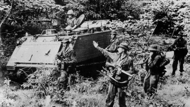 Australian soldiers on patrol on foot in the jungle in Vietnam.