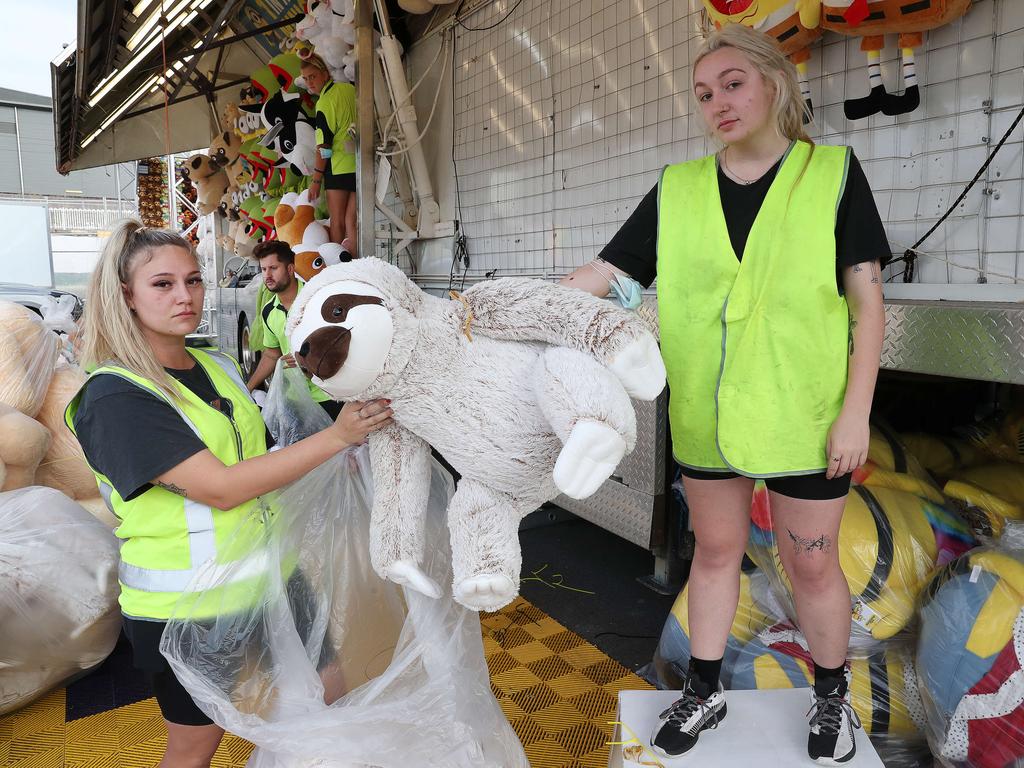 Savanah Fisher, 25 of Wallan VIC, packing up the games in Sideshow Alley after the Ekka was cancelled in 2021. Picture: Liam Kidston.