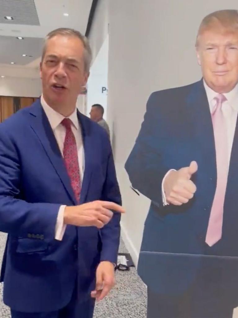 In another video, Mr Farage posed alongside a cardboard cut-out of Donald Trump, saying "this is great". Picture: Twitter / Nigel Farage