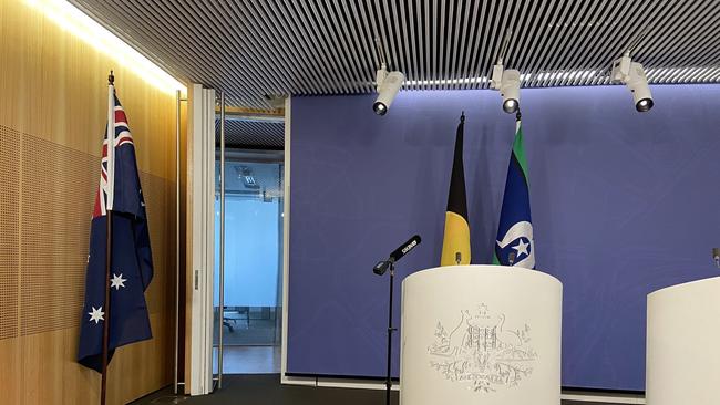 An Australian flag was moved to the side of the room prior to Greens leader Adam Bandt conducting a press conference where he did not want to have the Australian flag and what it symbolises in the camera frame as he spoke.