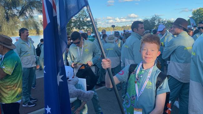 Robbie Yates, 14, flies the Australian flag at the World Transplant Games. Picture: Supplied