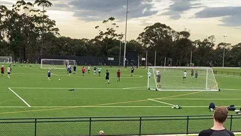 Men, flouting COVID-19 social distancing rules, playing a game of 11-a-side soccer on one of the playing fields at Lionel Watts Reserve, Frenchs Forest. Picture: Facebook