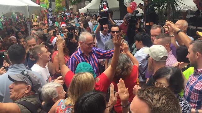 PM feeds the homeless and dances with partygoers on Christmas Day