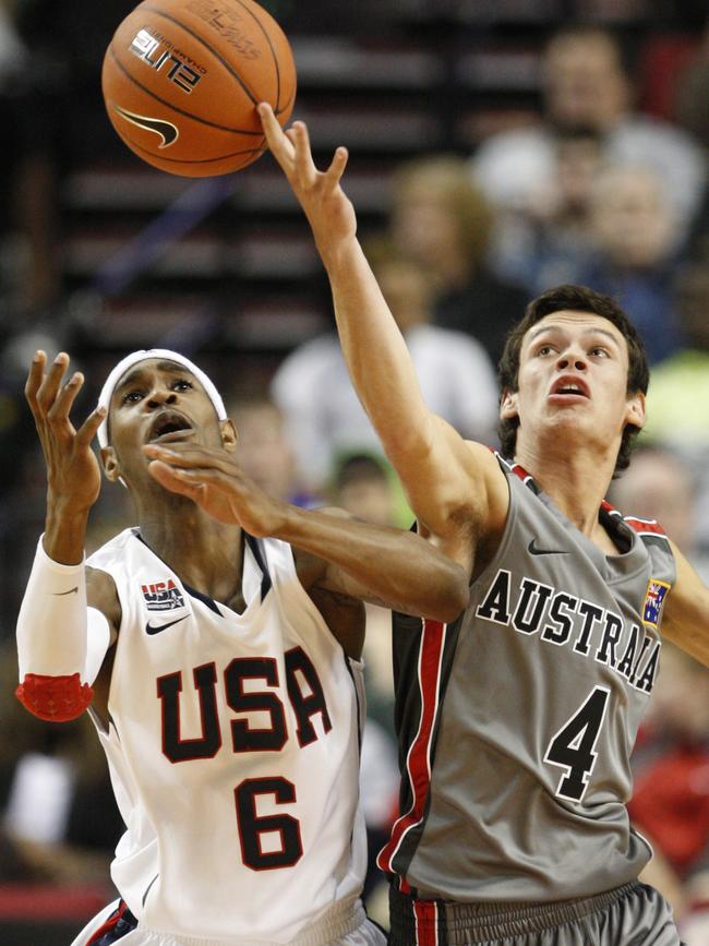 Jason Cadee competes with Will Barton at the 2010 Nike Hoops Summit in Portland. Picture: AP