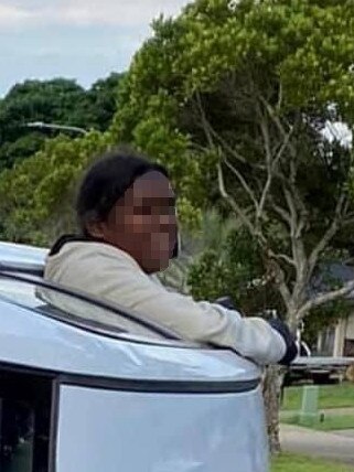 A 15-year-old girl pops out the window of a crashed stolen car last year. Picture: Supplied