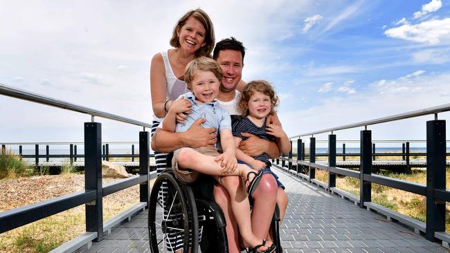 Scott and Clair Crowley with their children Oliver (5) &amp; Maddy (3) at Seacliff beach. It is a story about traveling with a disability. Picture: Bianca De Marchi