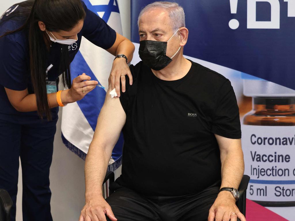 Former Israeli prime minister Benjamin Netanyahu receives a third dose of the Pfizer vaccine. Israel launched its campaign to give booster shots to people aged over 60. Picture: AFP