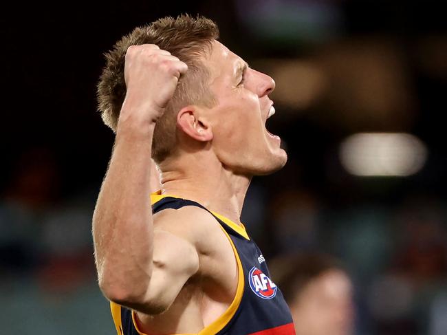 ADELAIDE, AUSTRALIA - AUGUST 22: David Mackay of the Crows celebrates a goal during the 2021 AFL Round 23 match between the Adelaide Crows and the North Melbourne Kangaroos at Adelaide Oval on August 22, 2021 in Adelaide, Australia. (Photo by James Elsby/AFL Photos via Getty Images)
