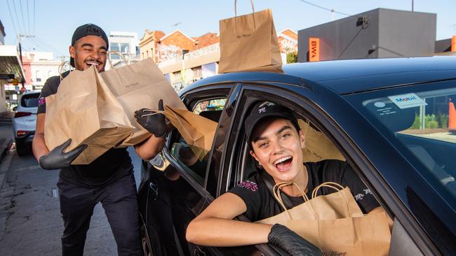 Milly Darby and Max Kooyman-Hardge from Melbourne-based Mr Miyagi are waiters who have switched to being food delivery drivers to stay employed. Picture: Jason Edwards