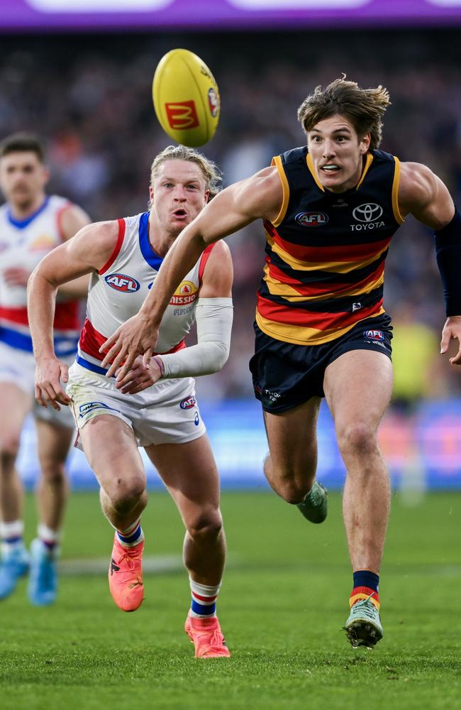 Josh Worrell leads Cody Weightman to the ball on Sunday. Picture: Mark Brake/Getty Images.