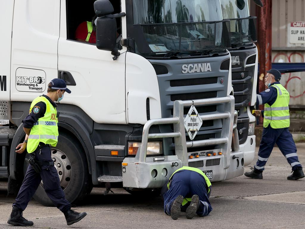 NSW Police and Transport NSW officers raid the Kit Bros depot in Liverpool following Mostafa Baluch’s arrest. Picture: Toby Zerna