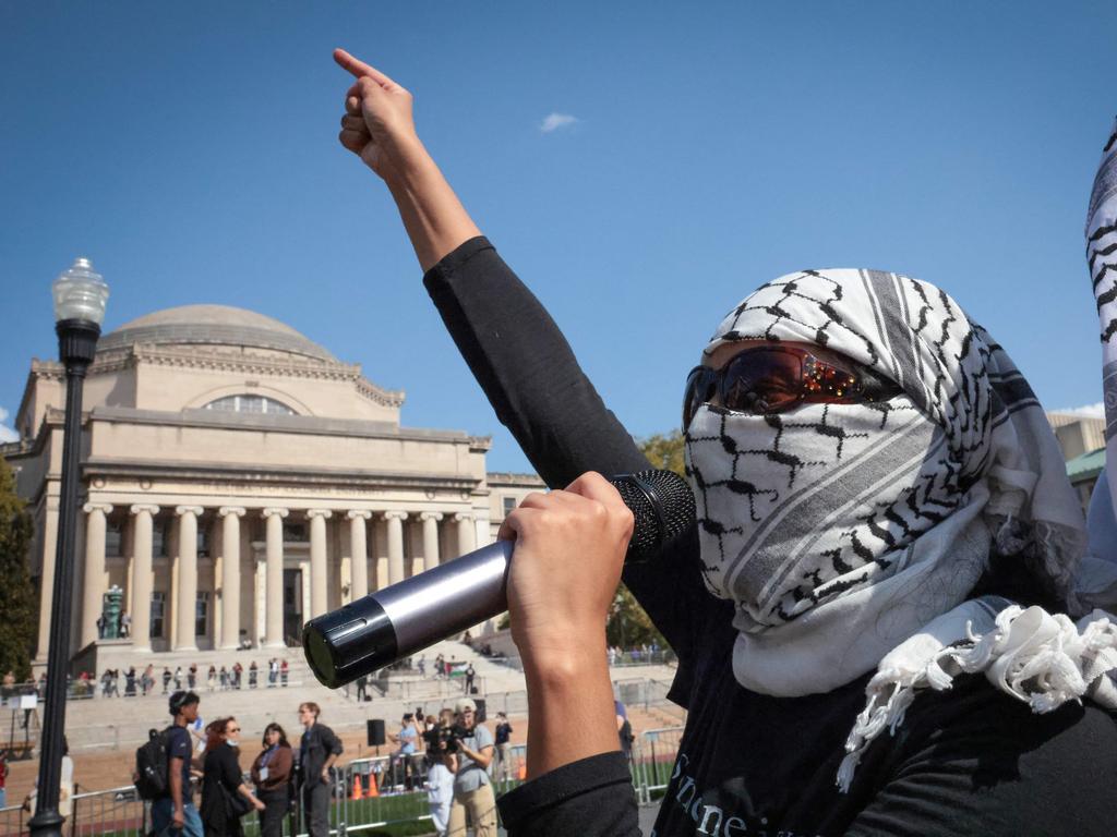 Pro-Palestinian demonstrators march through the Columbia University campus. The Palestinian leader of the demonstrations has been taken into custody from ICE and faces deportation. Picture: AFP