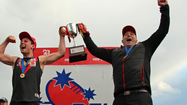 Ballarat Football League Grand Final between Bacchus Marsh and Sunbury. Bacchus Marsh 13.21 (99) proved too good for Sunbury 5.14 (44). Cobras coach Travis Hodgson and captain Tyson Shea hold the cup aloft. Picture: Aaron Cook