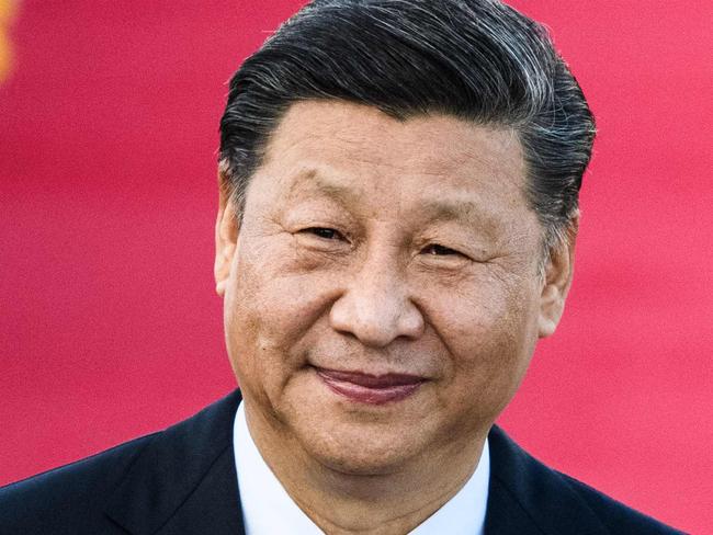 China's President Xi Jinping manages a smile, despite world condemnation for his country’s virus spreading across the globe. Picture: AFP