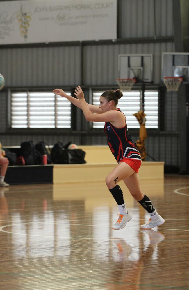 Netball action from QISSN 2024 in Townsville. Carmel College v Shalom College