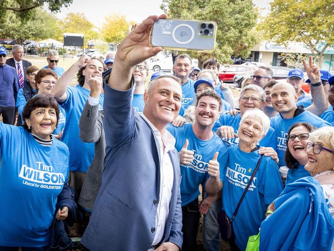 Tim Wilson celebrates with supporters after claiming victory. Picture: Jake Nowakowski
