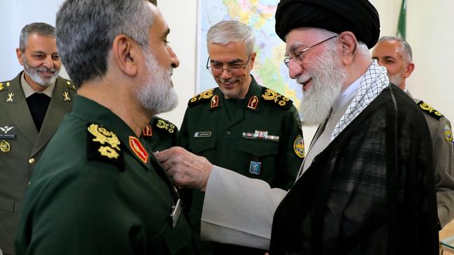 Iran's Supreme Leader Ayatollah Ali Khamenei gives Islamic Revolutionary Guard Corps' Aerospace Force Commander Brigadier General Amir Ali Hajizadeh an award for planning the Iranian attack on Israel. Picture: AFP.