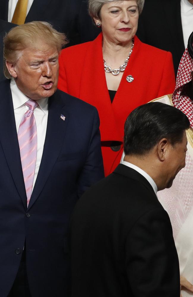 President Trump was seen speaking to Chinese President Xi Jinping after they shook hands at a family photo session at G20 summit.