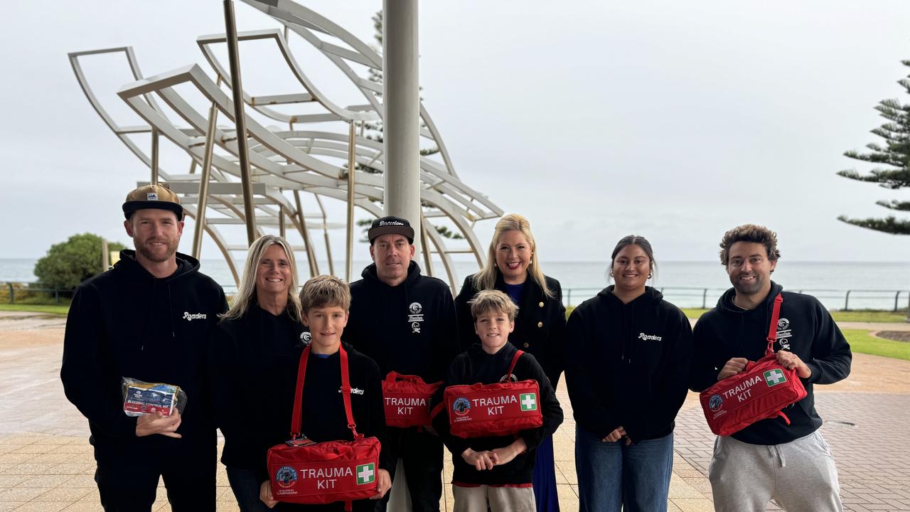 Minister Katrine Hildyard with members of the Seaview Road Boardriders, Khai Cowleys surfing club with Surfing SA safety equipment Picture: Supplied