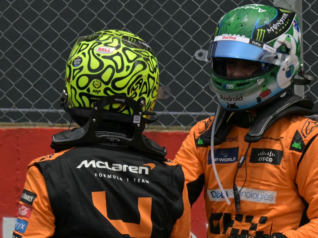 McLaren's British driver Lando Norris (R) greets McLaren's Australian driver Oscar Piastri after the Sprint race at the Jose Carlos Pace racetrack, aka Interlagos, in Sao Paulo, Brazil, on November 2, 2024, on the eve of the Formula One Sao Paulo Grand Prix. (Photo by NELSON ALMEIDA / AFP)