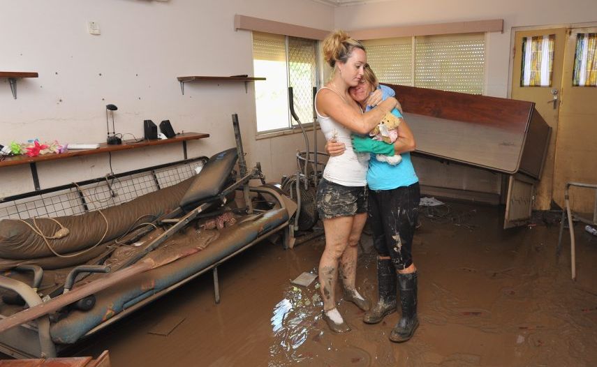 Maryborough floods - Donna Belford's house on Ann St. Donna and her daughter Julie-Anne stand in their mud caked lounge room. Photo: Alistair Brightman / Fraser Coast Chronicle. Picture: Alistair Brightman