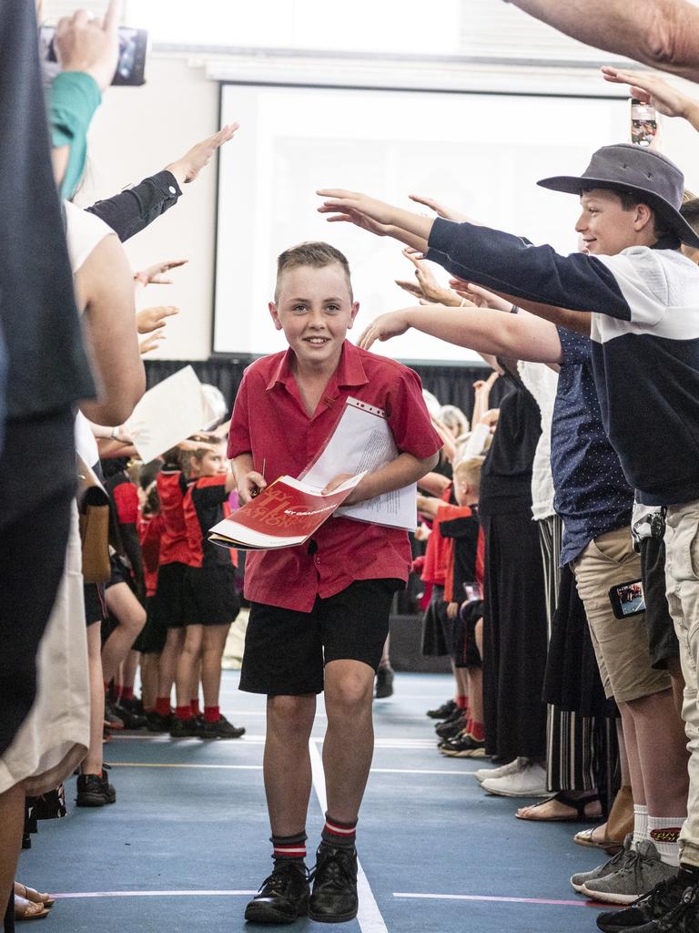 Sacred Heart Primary School 2022 school captain Tyce Fraser leaves the awards presentation and Yr 6 graduation under the arch of honour formed by attendees, Friday, December 2, 2022. Picture: Kevin Farmer