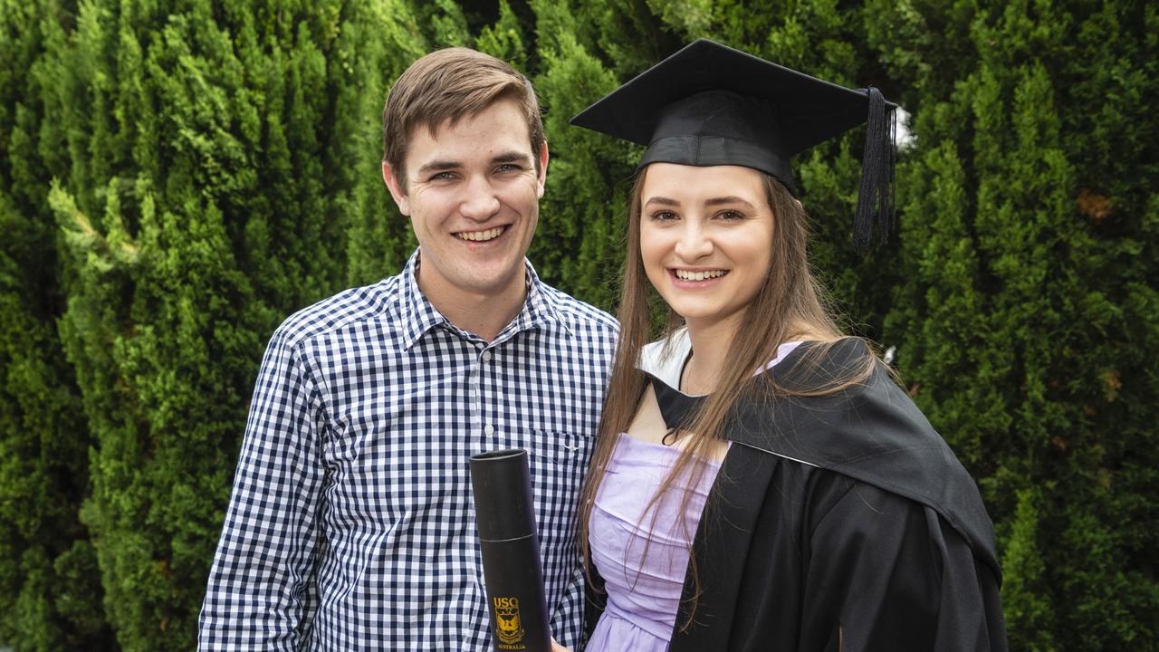 Jacob Luck with Bachelor of Business and Bachelor of Commerce graduate Katelyn Beresford at the UniSQ graduation ceremony at Empire Theatres, Tuesday, December 13, 2022. Picture: Kevin Farmer