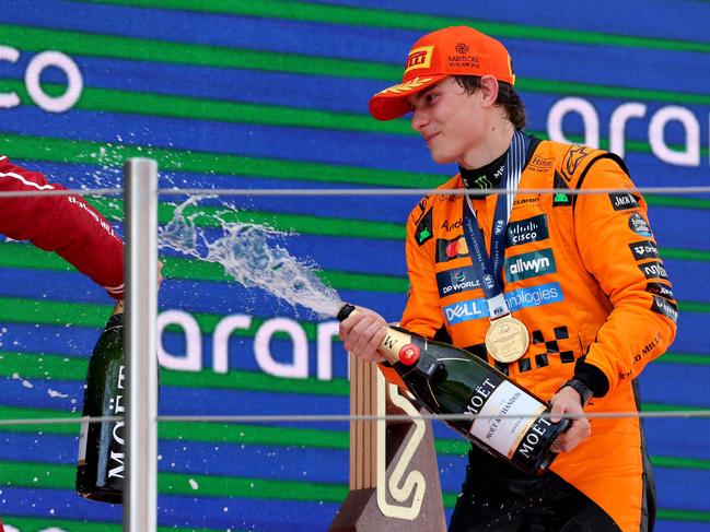 TOPSHOT - McLaren's Australian driver Oscar Piastri celebrates on the podium after winning the Formula One Spanish Grand Prix at the Circuit de Catalunya in Montmelo, on the outskirts of Barcelona, on June 1, 2025. (Photo by LLUIS GENE / AFP)