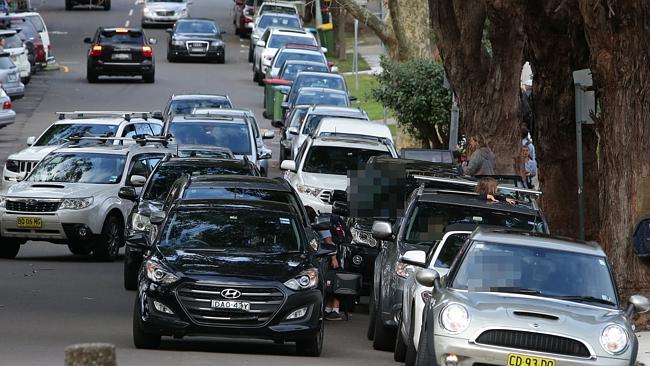 Cars line up in Mosman to pick up children after school. Picture: Adam Ward
