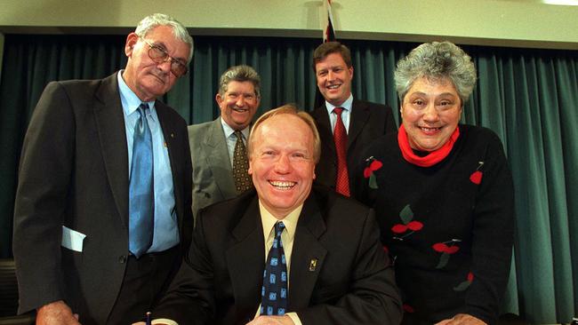 Premier Peter Beattie singing the contract with indigenous elders in 2001.