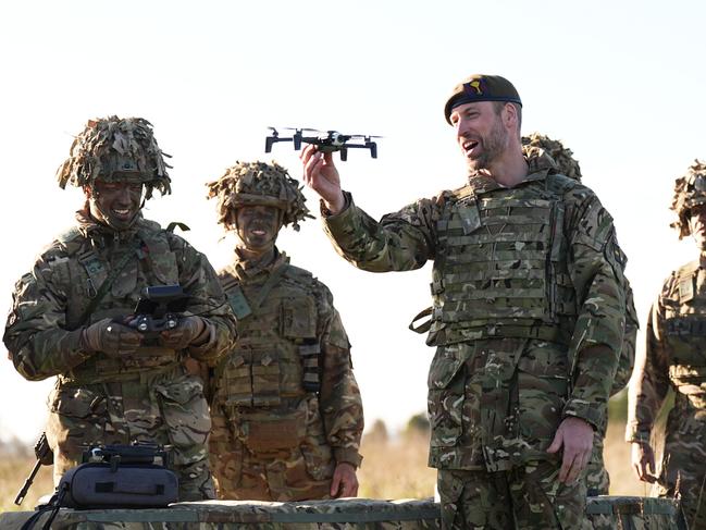 Prince William had a go at flying a drone during his visit. Picture: Getty Images