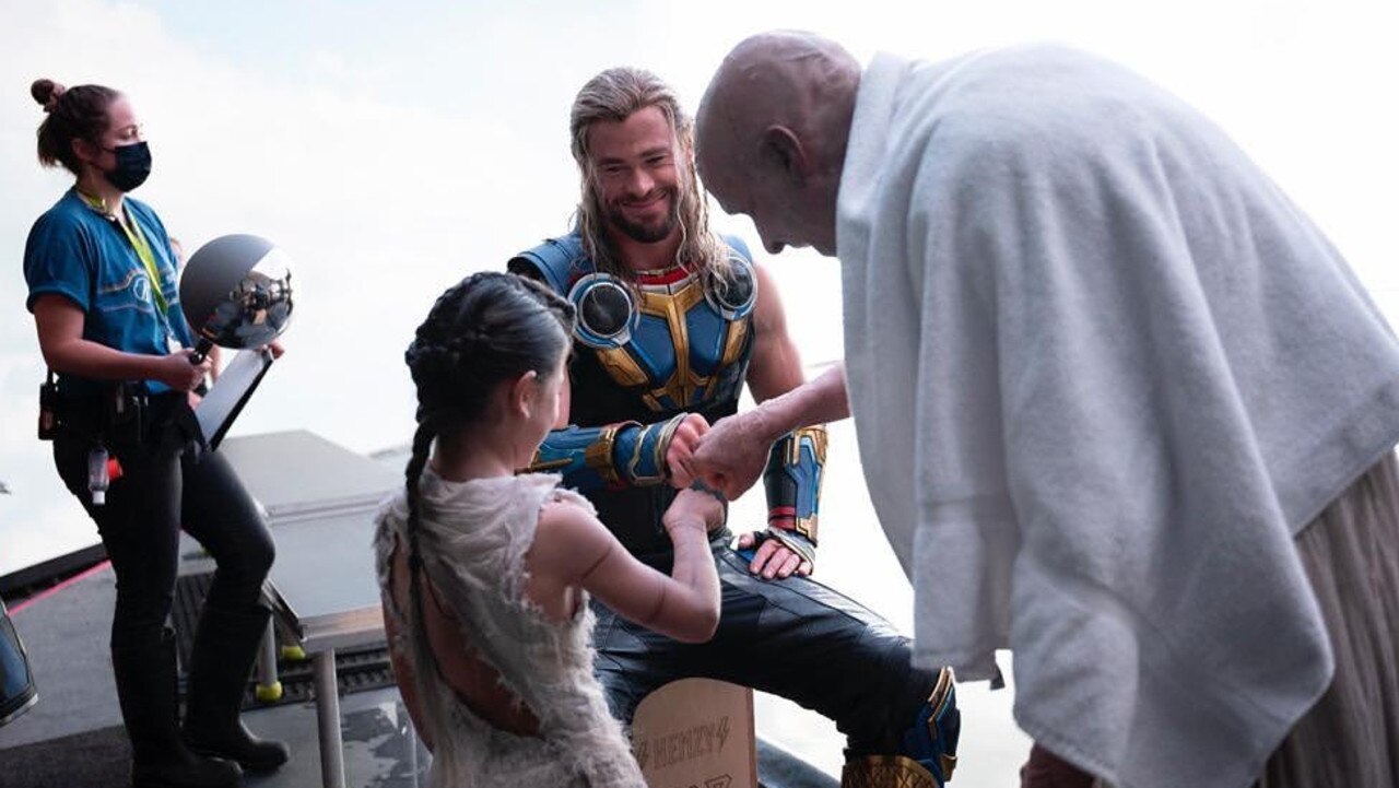 India Hemsworth on the set of Thor: Love and Thunder with dad Chris Hemsworth and actor Christian Bale. Photo: Instagram