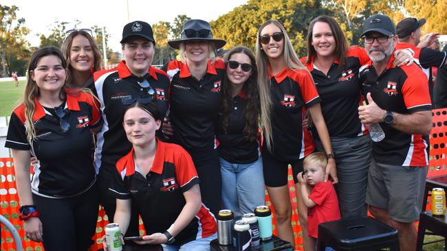 Bec Pugh, Adrienne Codd, Tahlia Olajos, Bridie McGough, Sophie McGough, Emily Bradshaw, Darren Boase, Mackenzie Guest and Kelly Boase at the AFL Capricornia grand finals, Rockhampton Cricket Grounds, September 10, 2022.