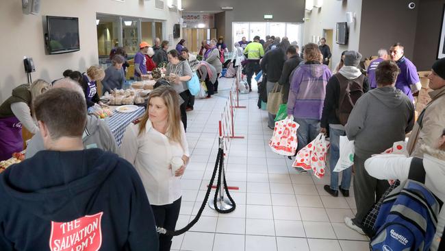 Salvation Army's Madeliene Scicluna giving a hand to regular user of the service. Picture: AAP Image/Dean Martin