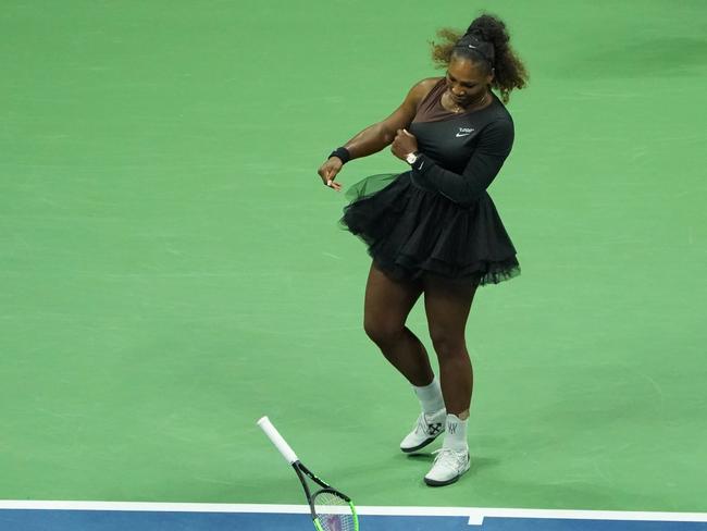 Serena Williams smashes her racquet while playing Naomi Osaka. Picture: Kena Betancur/AFP