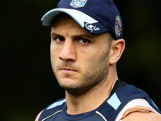 Robbie Farah with his injured shoulder taped up during warm up for NSW Blue's State of Origin training at the Pacific Bay Resort,Coffs Harbour .Picture Gregg Porteous