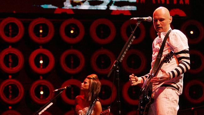 In a file photo Billy Corgan, right, and Ginger Reyes of the Smashing Pumpkins perform at Live Earth in East Rutherford, N.J. on Saturday, July 7, 2007. (AP Photo/Tim Larsen/file )