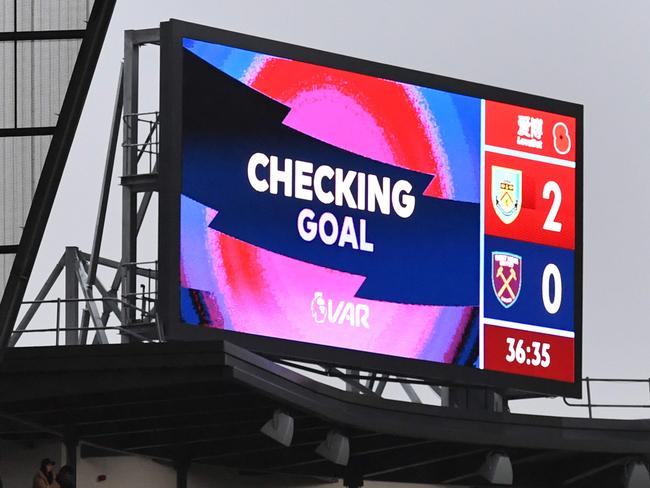 An electronic screen informs the spectators that the Video Assistant Referee (VAR) is checking a goal , which would have been Burnley's second before VAR eventually rules it out during the English Premier League football match between Burnley and West Ham United at Turf Moor in Burnley, north west England on November 9, 2019. (Photo by Paul ELLIS / AFP) / RESTRICTED TO EDITORIAL USE. No use with unauthorized audio, video, data, fixture lists, club/league logos or 'live' services. Online in-match use limited to 120 images. An additional 40 images may be used in extra time. No video emulation. Social media in-match use limited to 120 images. An additional 40 images may be used in extra time. No use in betting publications, games or single club/league/player publications. /