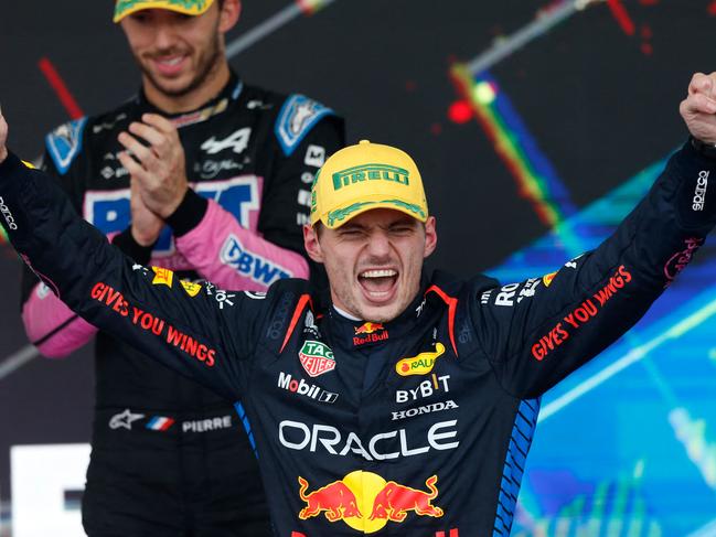 TOPSHOT - Red Bull Racing's Dutch driver Max Verstappen celebrates at the podium after winning the Formula One Sao Paulo Grand Prix, at the Jose Carlos Pace racetrack, aka Interlagos, in Sao Paulo, Brazil, on November 3, 2024. (Photo by Miguel Schincariol / AFP)