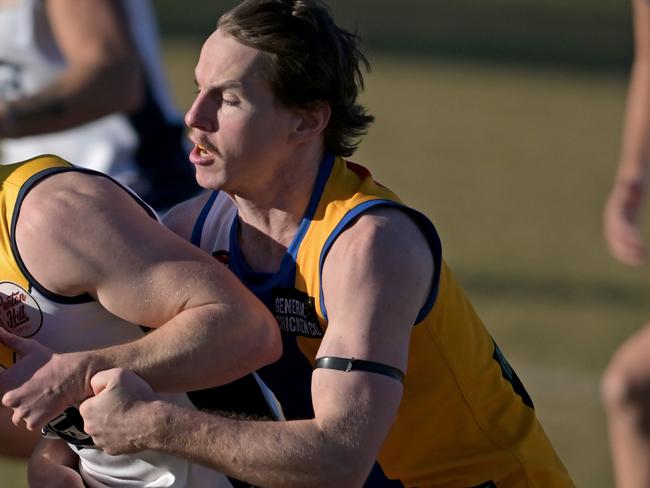 HurstbridgeÃs Mitchell Moschetti  and MacleodÃs Kurt Manuel during the NFNL Macleod v Hurstbridge football match in Rosanna, Saturday, June 17, 2023. Picture: Andy Brownbill