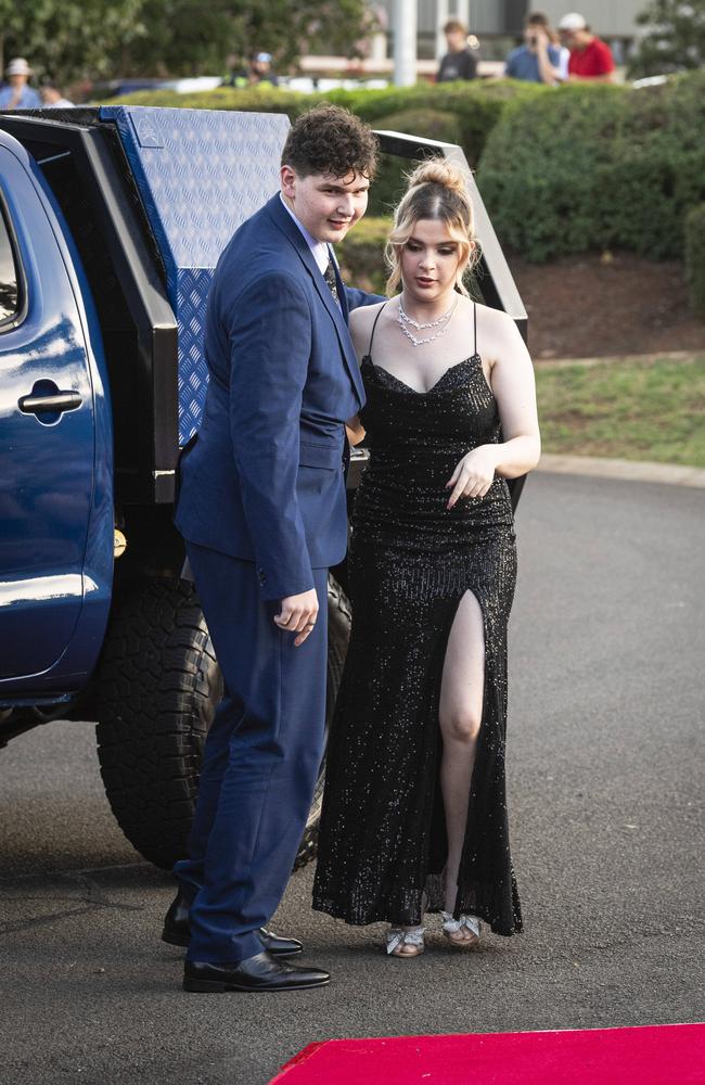 Graduate Logan Watson and partner Mia Watson arrive at Mary MacKillop Catholic College formal at Highfields Cultural Centre, Thursday, November 14, 2024. Picture: Kevin Farmer