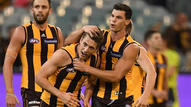 James Cousins enjoys a goal with Jaeger O’Meara. Picture: AAP