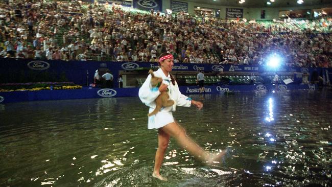 1995: Doubles star Natasha Zvereva enjoyed the wet conditions when Rod Laver Arena was transformed into a virtual swimming pool during the Australian open due to a blocked stormwater drain. Picture: Wayne Ludbey