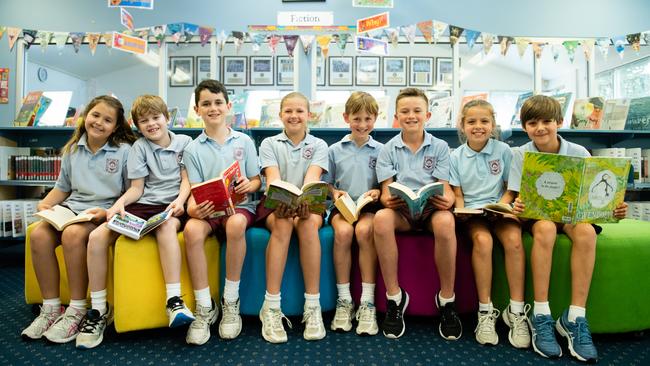 St Rose students enjoying books in the library.