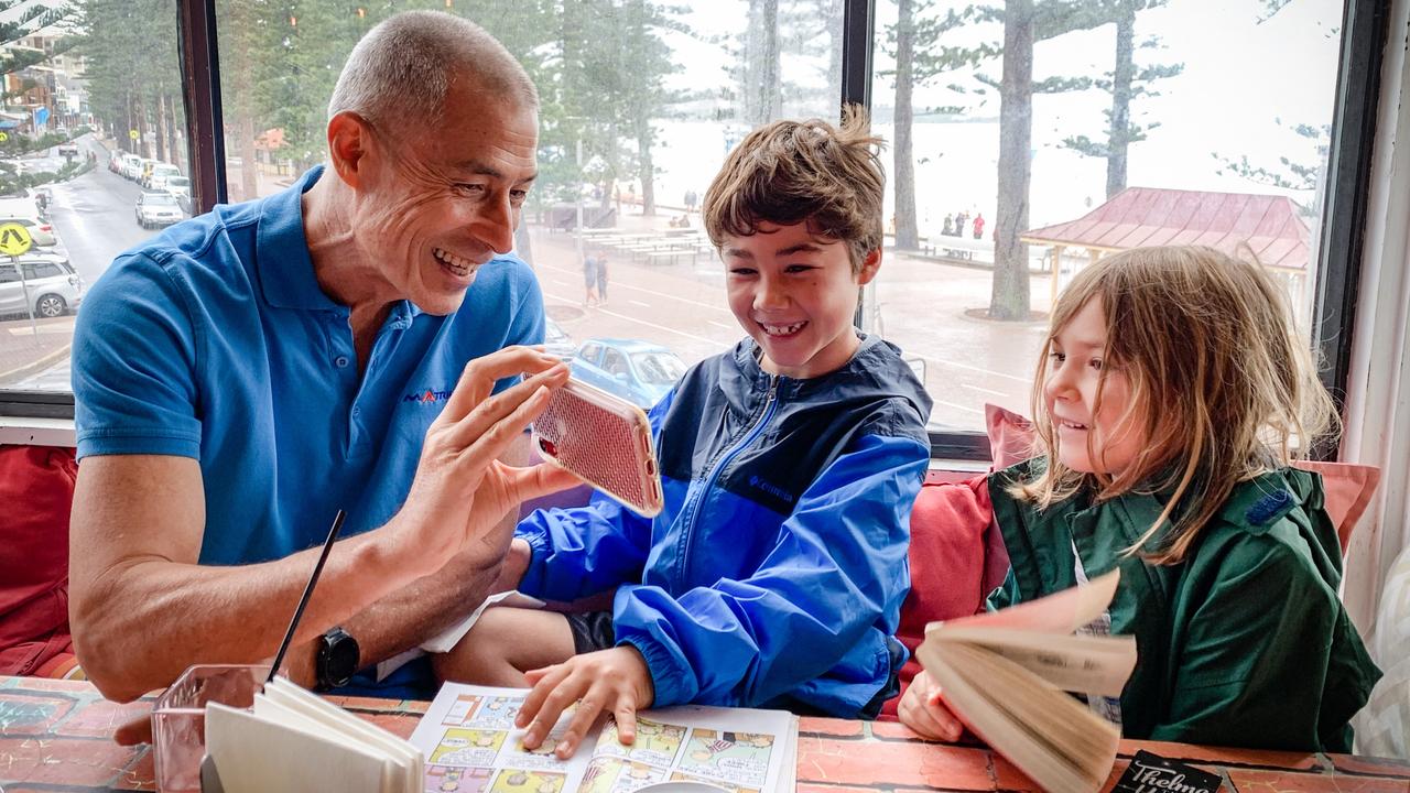 Sharing family stories is a great way to close the generation gap. Riley Lee relates to grandkids Oskar Lee, 11, and Freja Lee, 9, using different storytelling modes like Japanese manga and photos. Picture: supplied/Marieke Lee