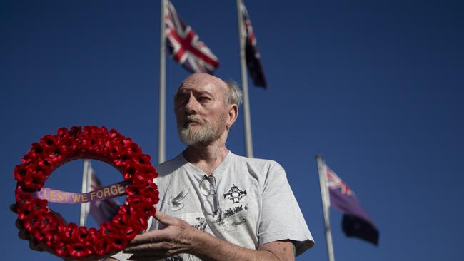 Mic Noble at the Logan war memorial, where the service was cancelled but he organised a video tribute. (AAP/Image Sarah Marshall)