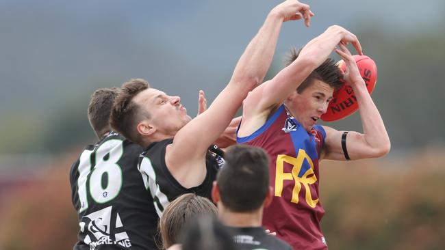 Kane Tyrrell (right) goes up for Pakenham. Picture: David Crosling